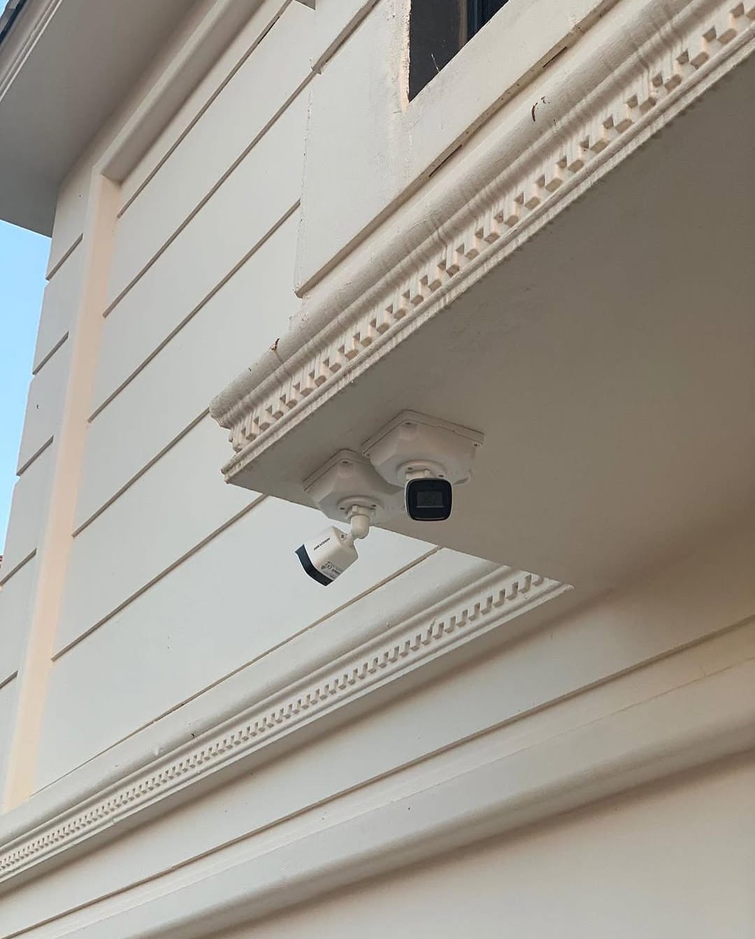 Corner Mounted Cameras on Building Facade